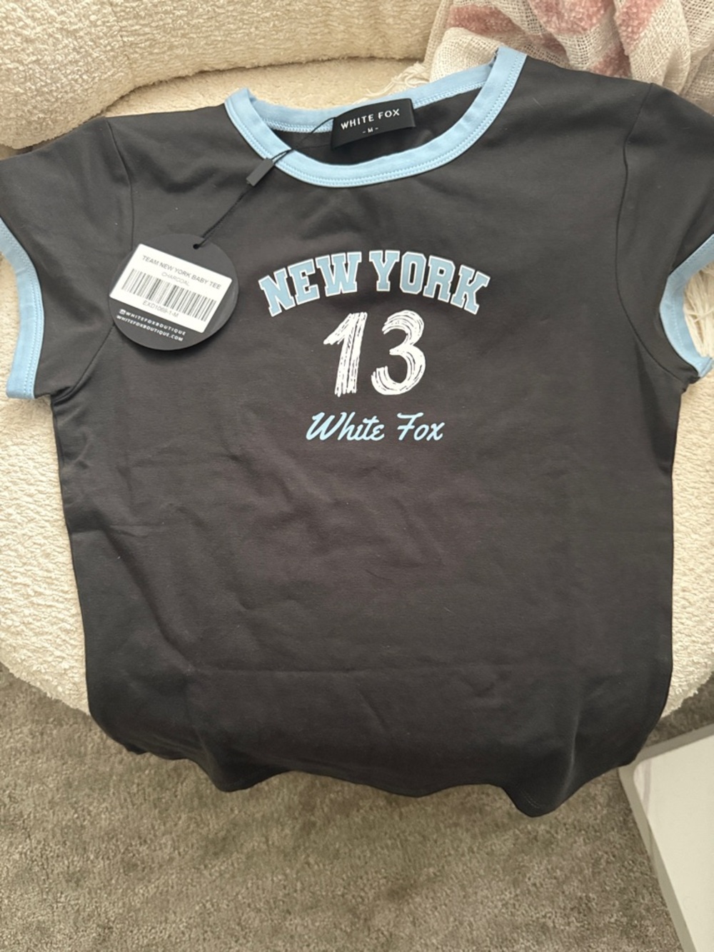 White Fox Boutique Black Tee with Light Blue Trim and New York 13 Graphic